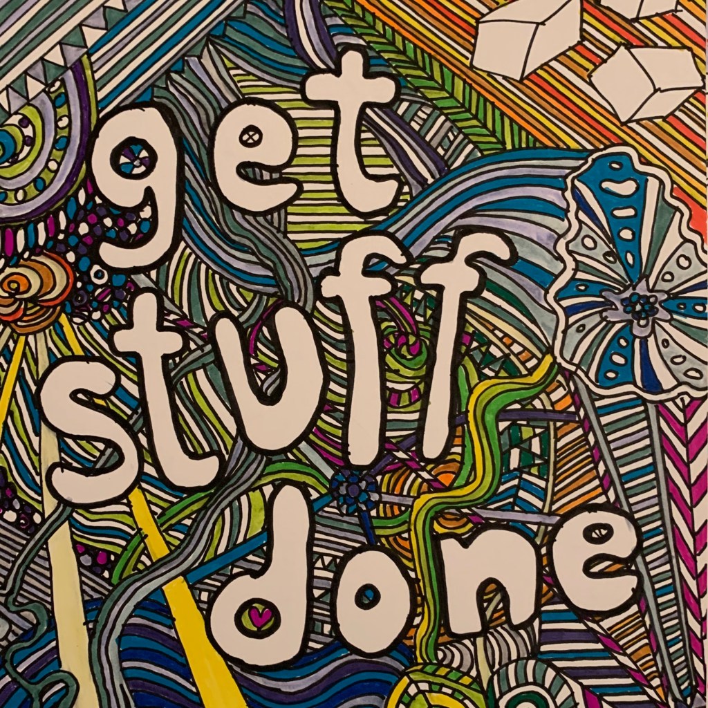 Photograph of the words “get stuff done” on a hand drawn zentangle-esque background coloured in various deep shades of felt tip pen.

© rainiestinertias.com